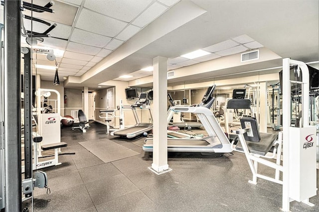 workout area featuring a paneled ceiling