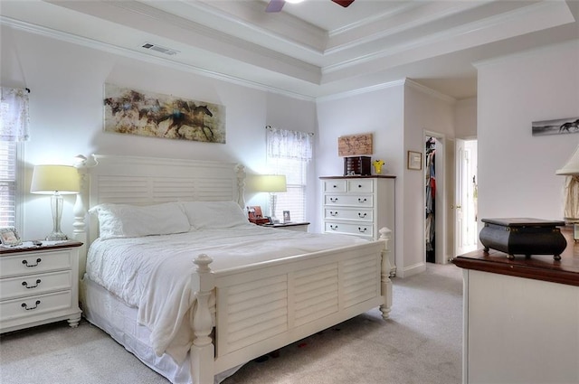 bedroom featuring ceiling fan, light colored carpet, and ornamental molding