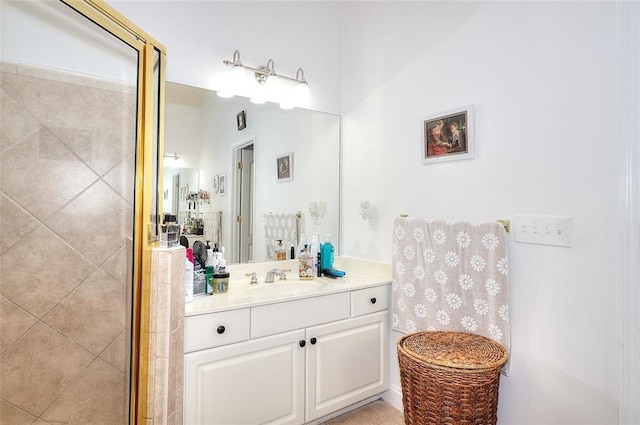 bathroom with a shower with shower door and vanity