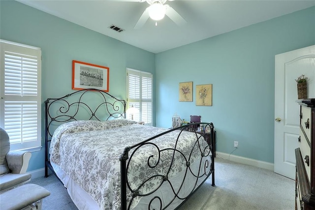 carpeted bedroom featuring ceiling fan