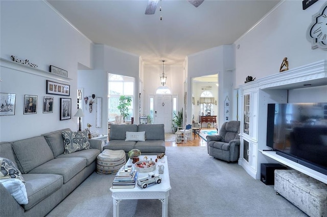 living room featuring ceiling fan and carpet floors