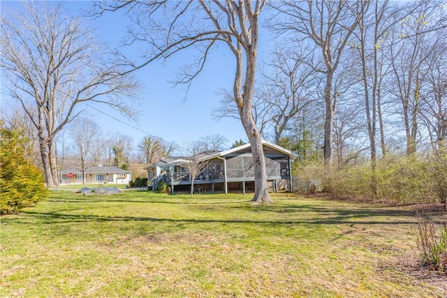 view of yard featuring a sunroom