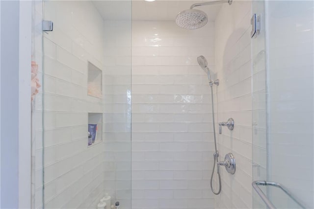 bathroom with a shower stall