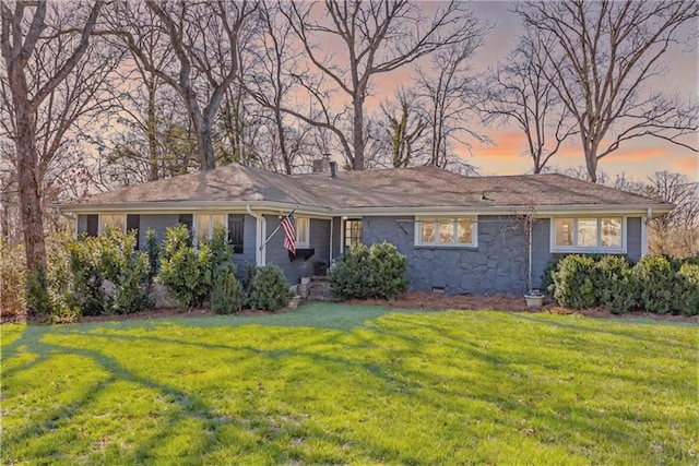 ranch-style home with crawl space, a chimney, and a front yard