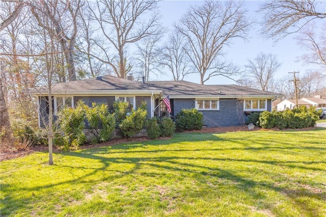 view of front of property with a front yard, a sunroom, and crawl space