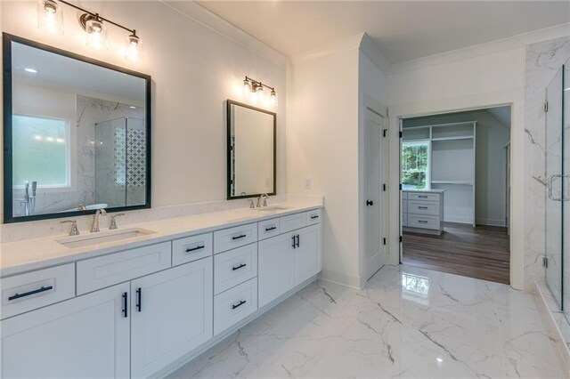 bathroom featuring hardwood / wood-style flooring, vanity, an enclosed shower, and ornamental molding