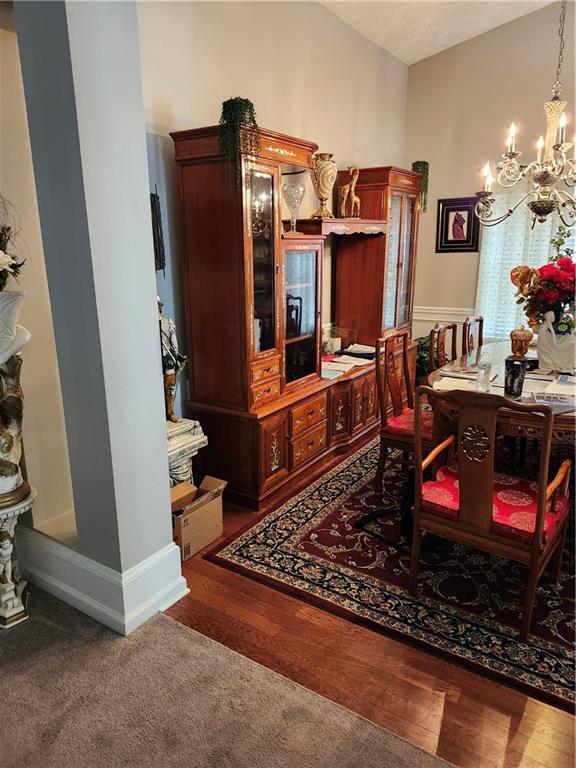 979 Simonton Glen Dr, Lawrenceville, GA 30045 - dining space featuring a chandelier and carpet