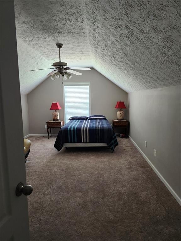 979 Simonton Glen Dr, Lawrenceville, GA 30045 - carpeted bedroom featuring a textured ceiling, vaulted ceiling, and ceiling fan