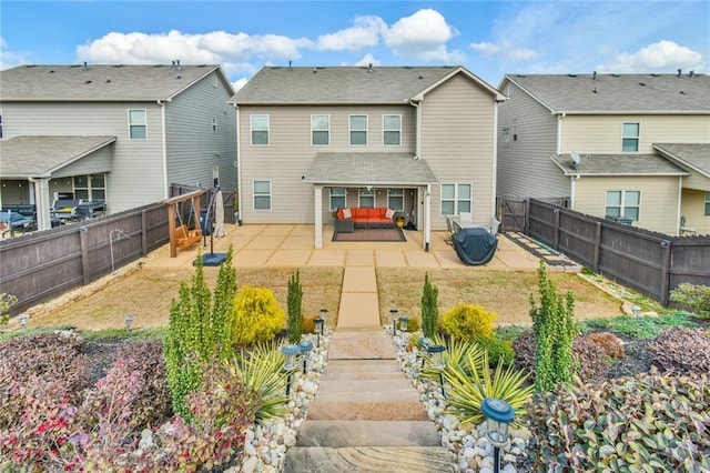 back of property featuring a patio area and a fenced backyard