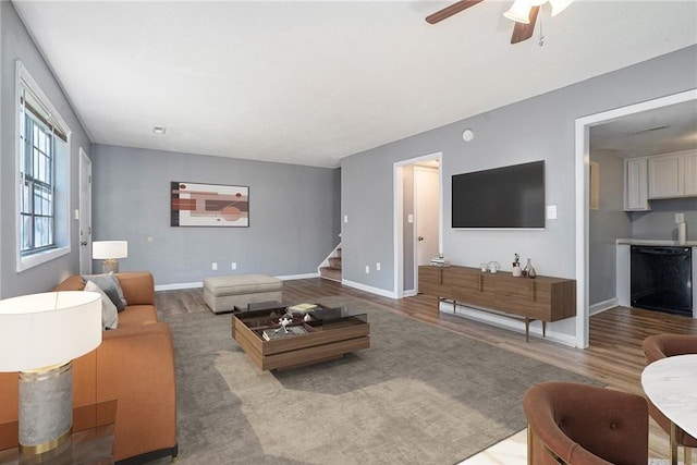 1151 Rankin St Unit 20A, Stone Mountain, GA 30083 - living area with wood finished floors, stairway, and ceiling fan