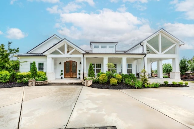 6044 Wade Orr Rd, Flowery Branch, GA 30542 - view of front facade featuring board and batten siding, covered porch, french doors, and a metal roof