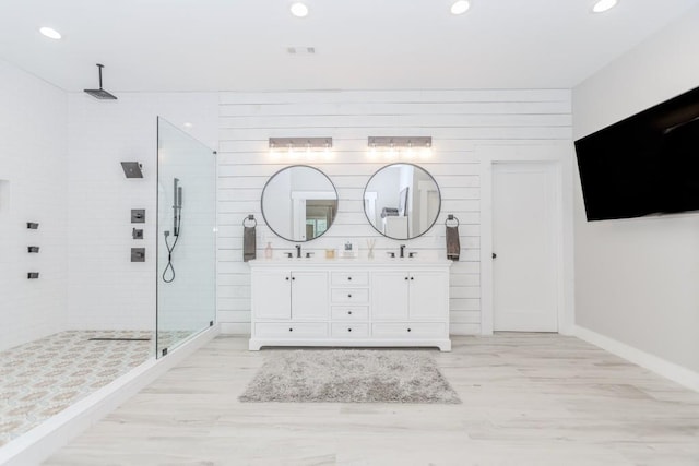 6044 Wade Orr Rd, Flowery Branch, GA 30542 - full bathroom with double vanity, a walk in shower, recessed lighting, and wood finished floors