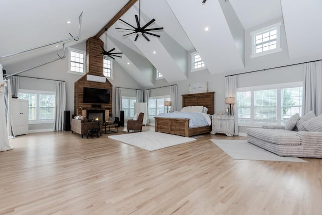 6044 Wade Orr Rd, Flowery Branch, GA 30542 - bedroom featuring high vaulted ceiling, a large fireplace, wood finished floors, beam ceiling, and recessed lighting