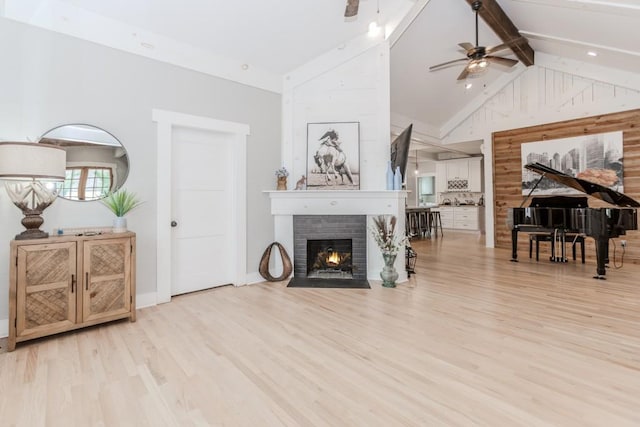 6044 Wade Orr Rd, Flowery Branch, GA 30542 - living room featuring light wood-type flooring, ceiling fan, high vaulted ceiling, a brick fireplace, and beamed ceiling