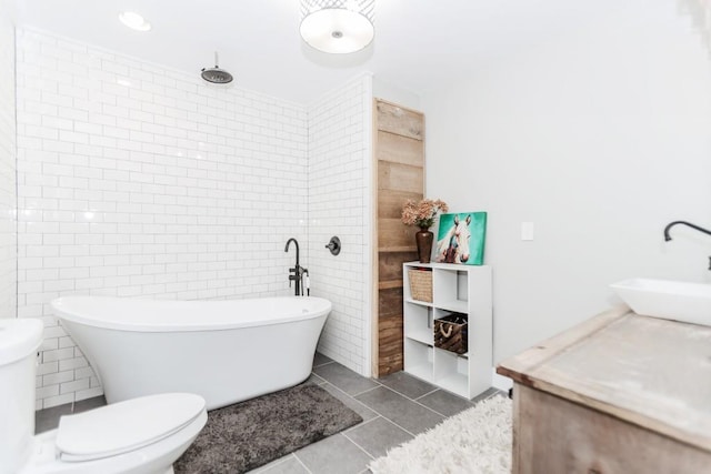 6044 Wade Orr Rd, Flowery Branch, GA 30542 - full bathroom featuring tile walls, a freestanding bath, tile patterned flooring, a tile shower, and vanity