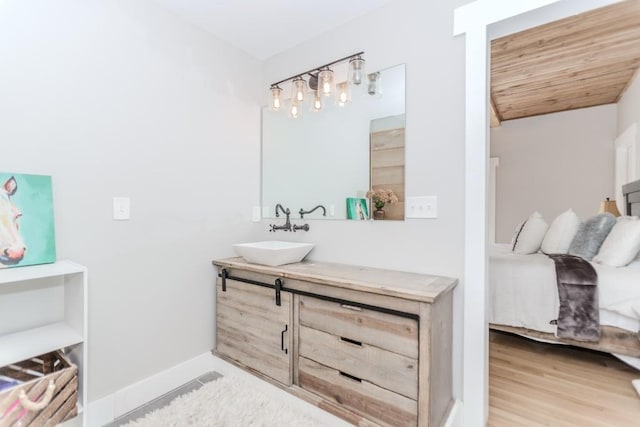 6044 Wade Orr Rd, Flowery Branch, GA 30542 - bathroom with vanity and wood finished floors
