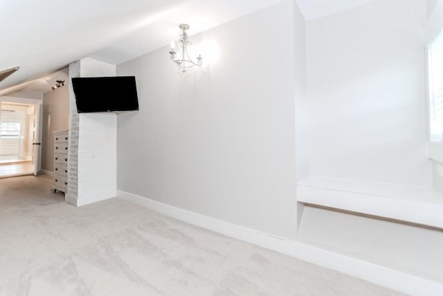 6044 Wade Orr Rd, Flowery Branch, GA 30542 - unfurnished living room featuring lofted ceiling, carpet, and a chandelier