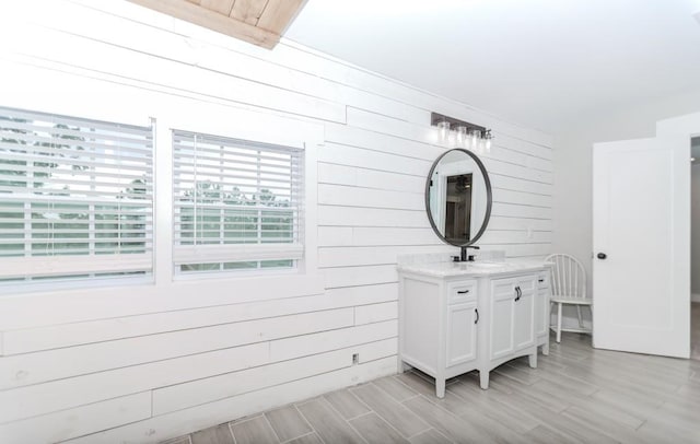 6044 Wade Orr Rd, Flowery Branch, GA 30542 - bathroom featuring vanity, wood walls, healthy amount of natural light, and wood tiled floors