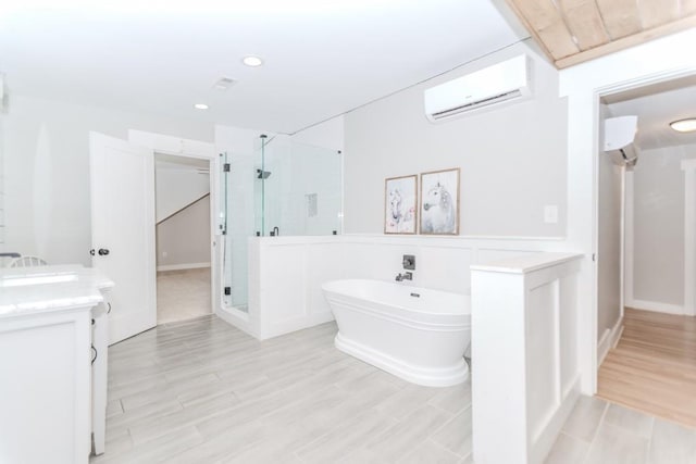6044 Wade Orr Rd, Flowery Branch, GA 30542 - full bath with a wall unit AC, a stall shower, a soaking tub, vanity, and recessed lighting