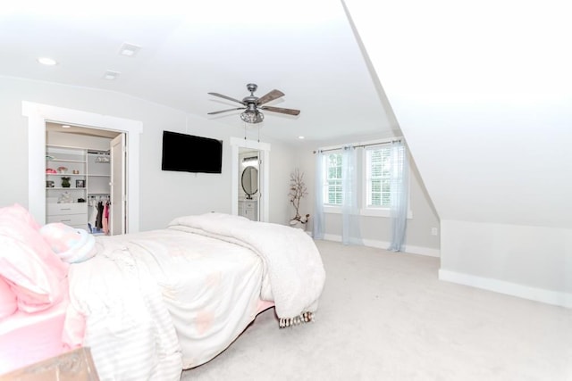 6044 Wade Orr Rd, Flowery Branch, GA 30542 - bedroom with lofted ceiling, light colored carpet, a walk in closet, ceiling fan, and recessed lighting