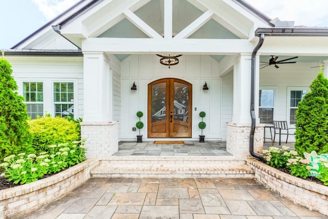 6044 Wade Orr Rd, Flowery Branch, GA 30542 - view of exterior entry featuring french doors, board and batten siding, and covered porch