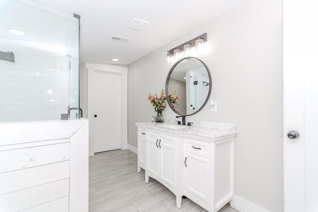 6044 Wade Orr Rd, Flowery Branch, GA 30542 - bathroom with vanity, a tile shower, and recessed lighting