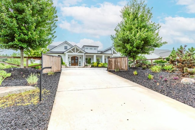 6044 Wade Orr Rd, Flowery Branch, GA 30542 - view of front of home with concrete driveway and a porch