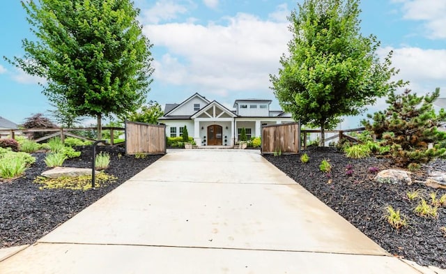 6044 Wade Orr Rd, Flowery Branch, GA 30542 - view of front of property featuring driveway, a gate, and a porch