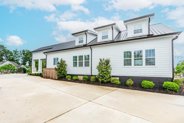 6044 Wade Orr Rd, Flowery Branch, GA 30542 - view of front of house with a metal roof and driveway