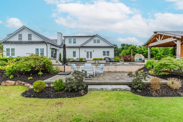 6044 Wade Orr Rd, Flowery Branch, GA 30542 - rear view of property with a yard, a patio, and an outdoor kitchen
