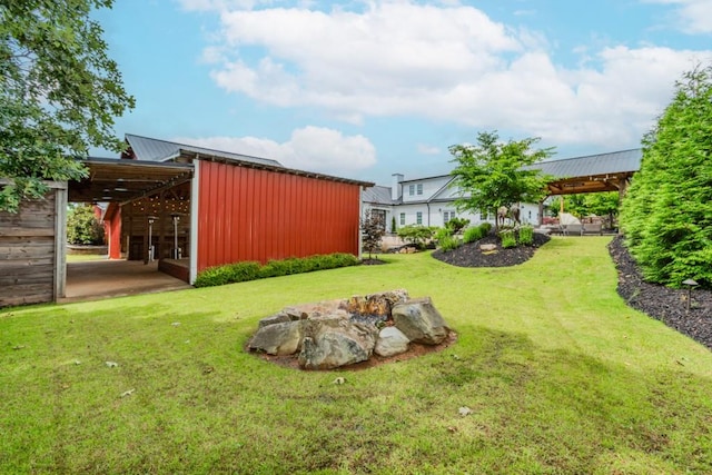 6044 Wade Orr Rd, Flowery Branch, GA 30542 - view of green lawn with a pole building and an outdoor structure