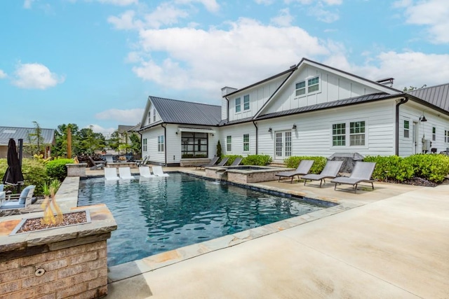 6044 Wade Orr Rd, Flowery Branch, GA 30542 - view of swimming pool with a fire pit, french doors, a patio, and a pool with connected hot tub