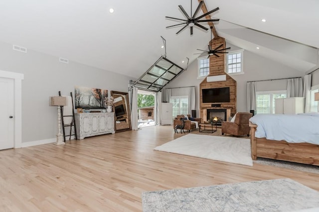 6044 Wade Orr Rd, Flowery Branch, GA 30542 - bedroom featuring high vaulted ceiling, a fireplace, wood finished floors, and recessed lighting