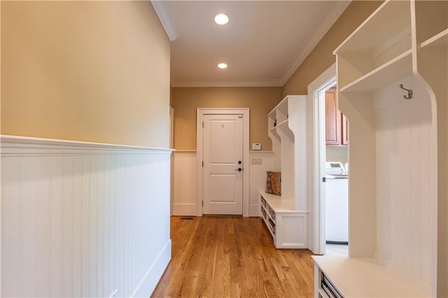 mudroom with washer / clothes dryer, wainscoting, ornamental molding, recessed lighting, and light wood-style flooring