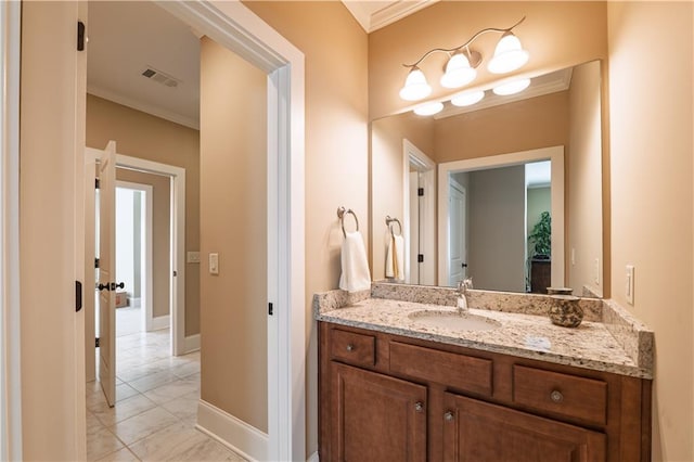 bathroom with crown molding, vanity, marble finish floor, baseboards, and visible vents