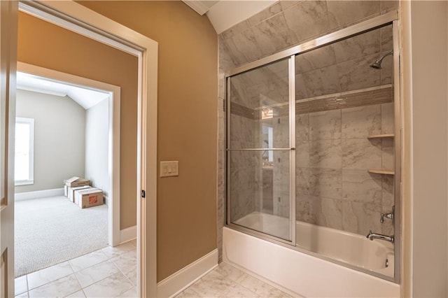 bathroom with enclosed tub / shower combo, marble finish floor, and baseboards