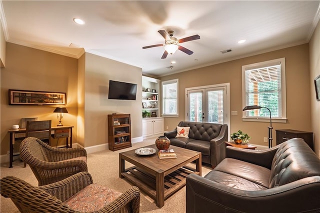 living room featuring baseboards, light carpet, a ceiling fan, and recessed lighting