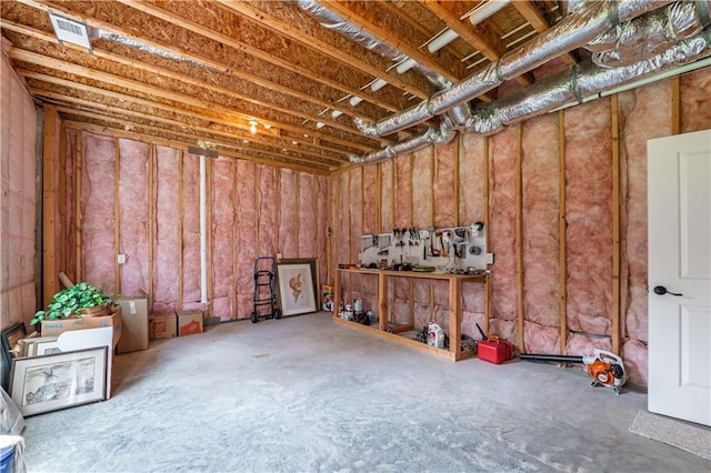 unfinished basement featuring visible vents