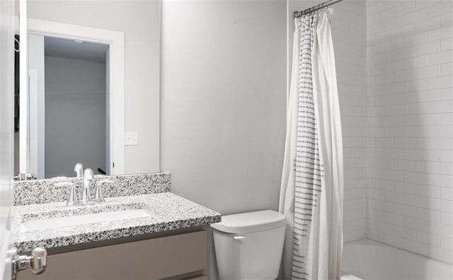 full bathroom featuring vanity, toilet, and shower / tub combo with curtain