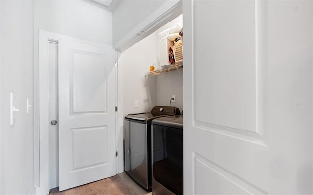 laundry room with washing machine and dryer