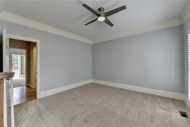 corridor with arched walkways, crown molding, a raised ceiling, and baseboards