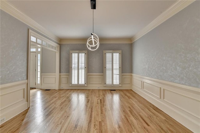 cinema room with a tray ceiling, crown molding, a ceiling fan, and light colored carpet