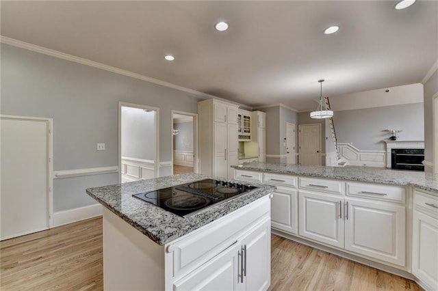 unfurnished living room featuring a tray ceiling, baseboards, carpet, and a ceiling fan