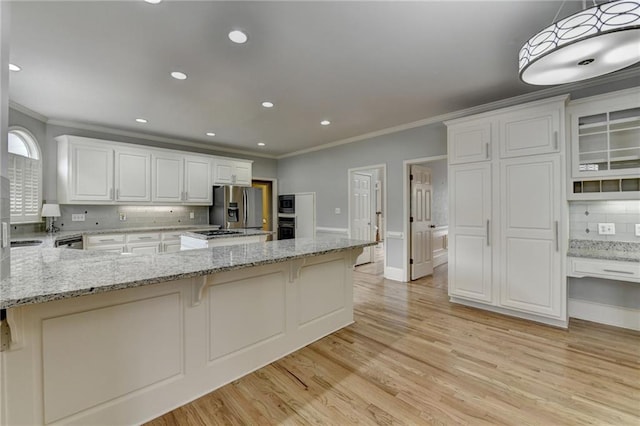 unfurnished living room featuring stairway, crown molding, a raised ceiling, and baseboards