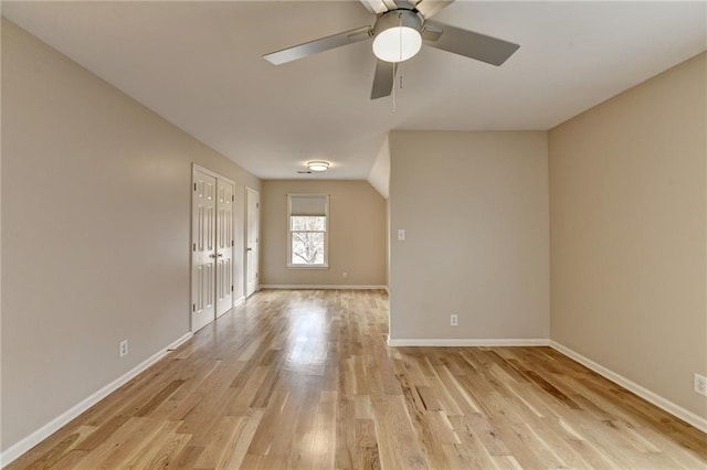 empty room featuring a ceiling fan, carpet, visible vents, plenty of natural light, and ornamental molding