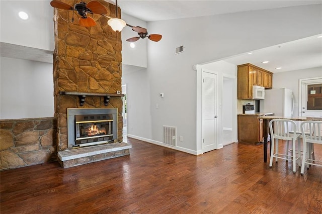 12 Windsor Way, Newnan, GA 30263 - living area with ceiling fan, dark wood finished floors, high vaulted ceiling, and a fireplace