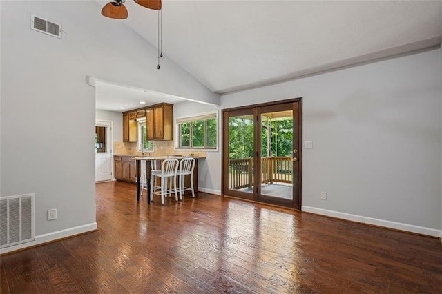 12 Windsor Way, Newnan, GA 30263 - living room featuring a ceiling fan, lofted ceiling, and dark wood-style flooring