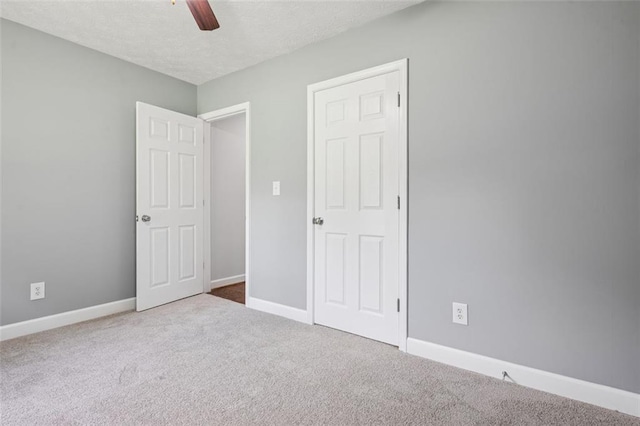 12 Windsor Way, Newnan, GA 30263 - unfurnished bedroom with carpet, a textured ceiling, and a ceiling fan