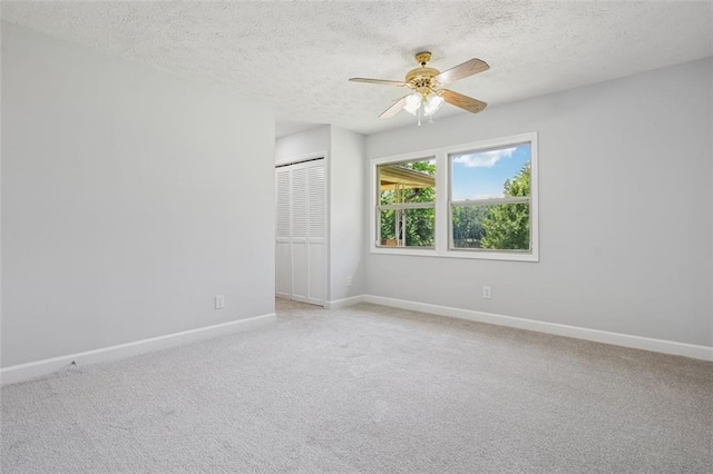 12 Windsor Way, Newnan, GA 30263 - empty room featuring a ceiling fan, a textured ceiling, and light carpet