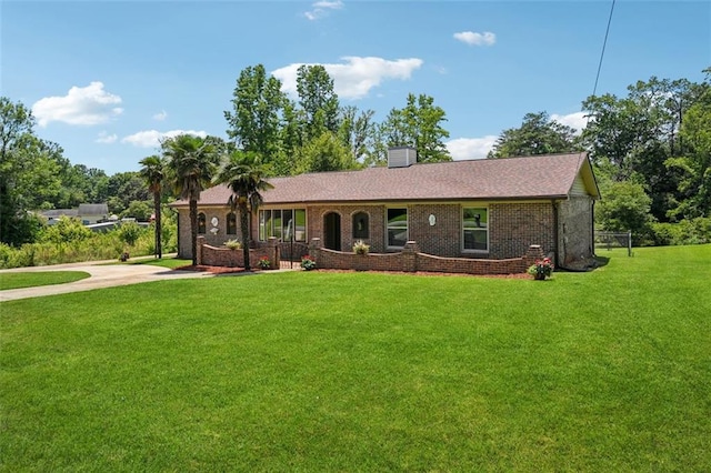 12 Windsor Way, Newnan, GA 30263 - ranch-style house featuring a front yard, brick siding, and a chimney
